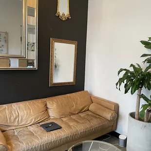 a living room with a leather couch