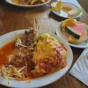 a plate of lasagna and watermelon