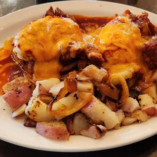 Eggs Benedict New Mexico style with home fry potatoes.