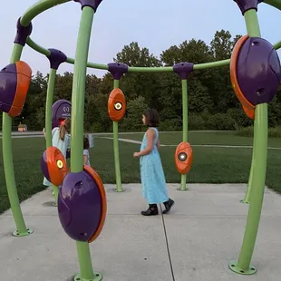 My grandkids playing on the music set at Hannah Park