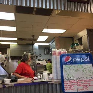 a woman behind the counter