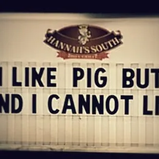 a sign saying like pig butts and i cannot't lie