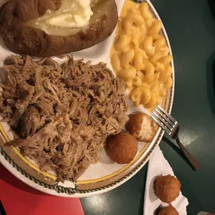 Pulled pork with baked potato and mac and cheese