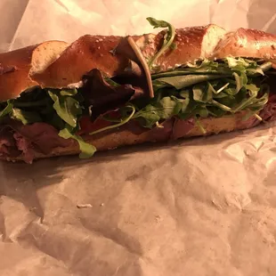 a sub sandwich on a piece of wax paper