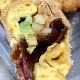 Breakfast Burrito -- scrambled eggs, cheddar, bacon, tater tots, avocado