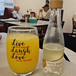 a glass of lemonade and a bottle of lemonade