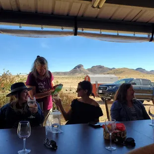 Our tasting patio provides sweeping views of the Mustang Mountains to the east.