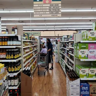 a woman pushing a shopping cart