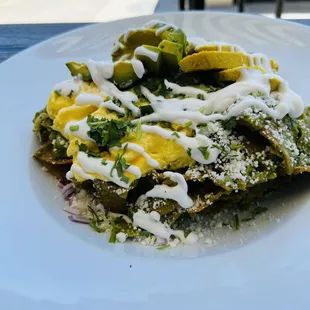 Green chilaquiles , added chicken and avocado .  delicious !