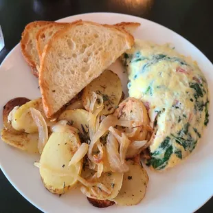 Pancetta and spinach omelet with potatoes and toast