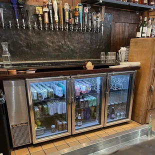 a bar with beer taps