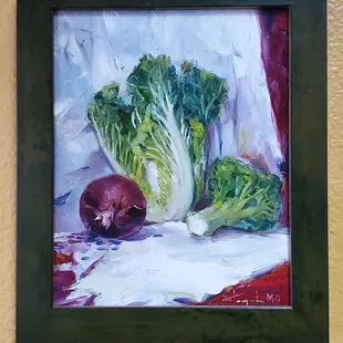 a painting of cabbage and onions