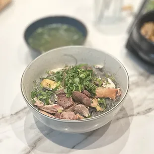 Miến gà trộn lòng xào: glass noodles mixed w/chicken, stir-fried giblets &amp; house sauce w/side soup | $15.55