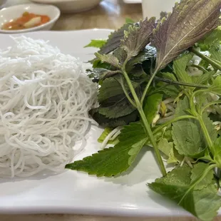 Vermicelli noodles and veggies/herbs on the side.