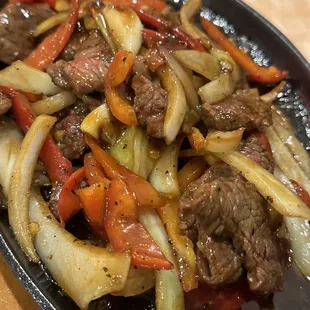 Country steak with peppers and onions