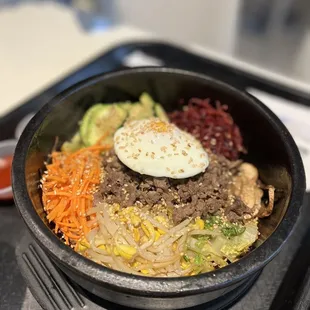 a bowl of food on a tray