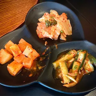 A La Carte Kimchi Trio is 3 kinds of kimchi: radish, Napa cabbage, &amp; cucumber. Was a bit overripe but good. $5   4.*