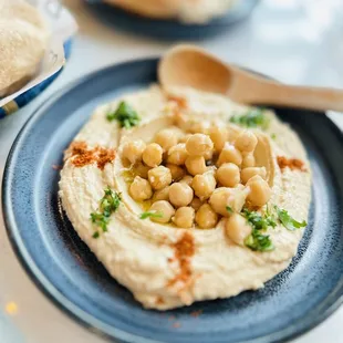 a plate of hummus and pita bread