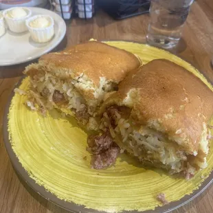 Corny Pancake Wrap- Extra large buttermilk Pancake stuffed with corned beef hash, American cheese, hash browns, and 2 eggs