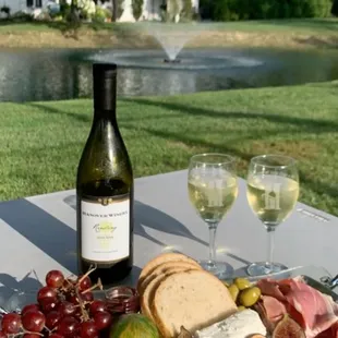 a glass of wine and a platter of food