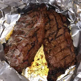 two steaks in foil