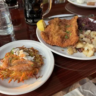 Pork schnitzel, red cabbage and potatoes along with some potato pancakes and a stout ale.