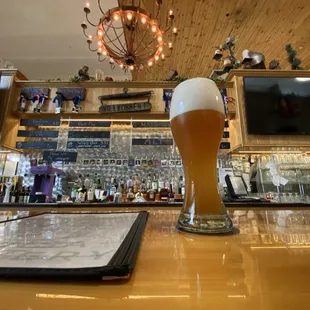 a glass of beer on the bar