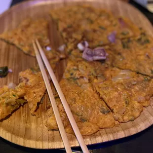 chopsticks on a wooden plate