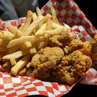 a basket of fried chicken and french fries