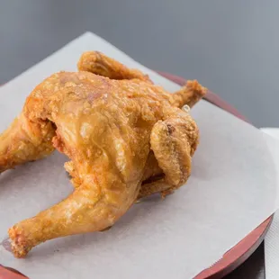 Whole fried chicken Famous whole fried chicken serve with Salad.