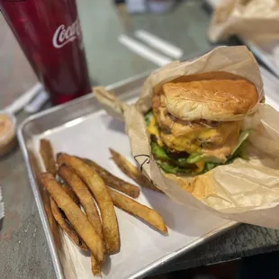Double cheeseburger with bacon and fries.