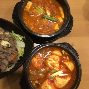 Kimchi soup (top) and Deonjang jigae: soybean soup w the seafood option (bottom)