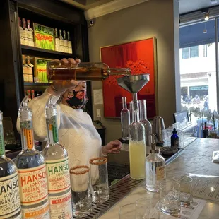 Shannon makes takeout cocktails at the Hanson of Sonoma Tasting Room at Hanson Gallery in Sausalito.
