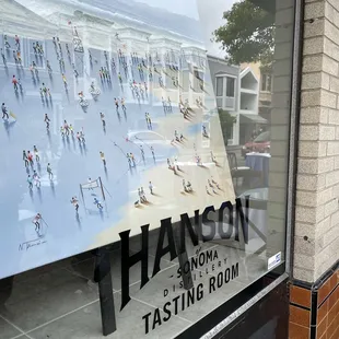 Artwork in the window at the Hanson of Sonoma Tasting Room at Hanson Gallery in Sausalito.