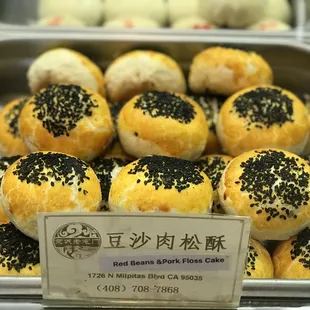 a variety of pastries in a display case