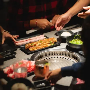 a group of people preparing food