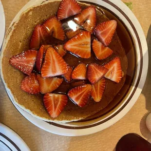 Pancakes topped with strawberries