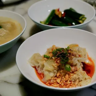Shrimp &amp; Pork wontons. Spicy chili oil one in front and broth one in the background