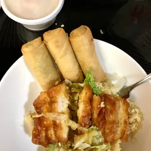 My dinner. Lemon chicken over white rice with extra vegetable spring rolls and egg drop soup. Super yummy! "Hen mei wei!"