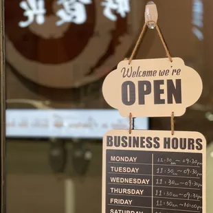 an open business hours sign