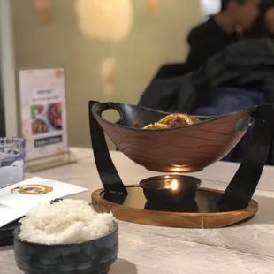 a bowl of rice and a bowl of meat