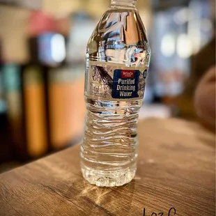 a bottle of water on a table