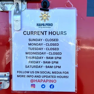 a closed sign on a red door