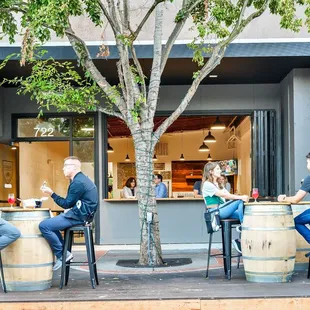 a group of people sitting at a bar