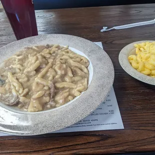 Homemade beef and noodles over mashed potatoes