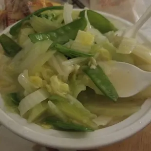 a bowl of soup with a spoon in it