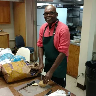 a man in a kitchen preparing food