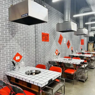 a dining area with tables and chairs