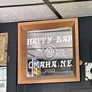 a sign on the wall of a bar