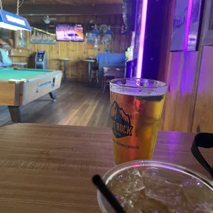 a cold drink and a pool table